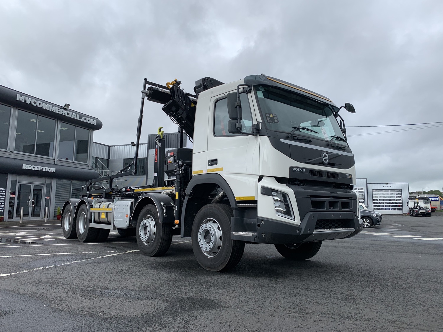 New Volvo FMX 460 8x4 Tridem mit Haken und Kran FASSI F545 Hook lift truck  for sale at Truck1 USA, ID: 7810530